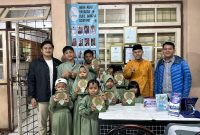 50 mushaf Al-Qur'an didistribusikan langsung oleh para pengurus dan anggota TIDAR Tangsel kepada Masyarakat